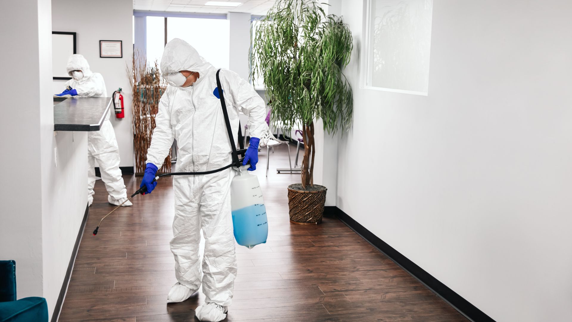 2 cleaners doing disinfection service