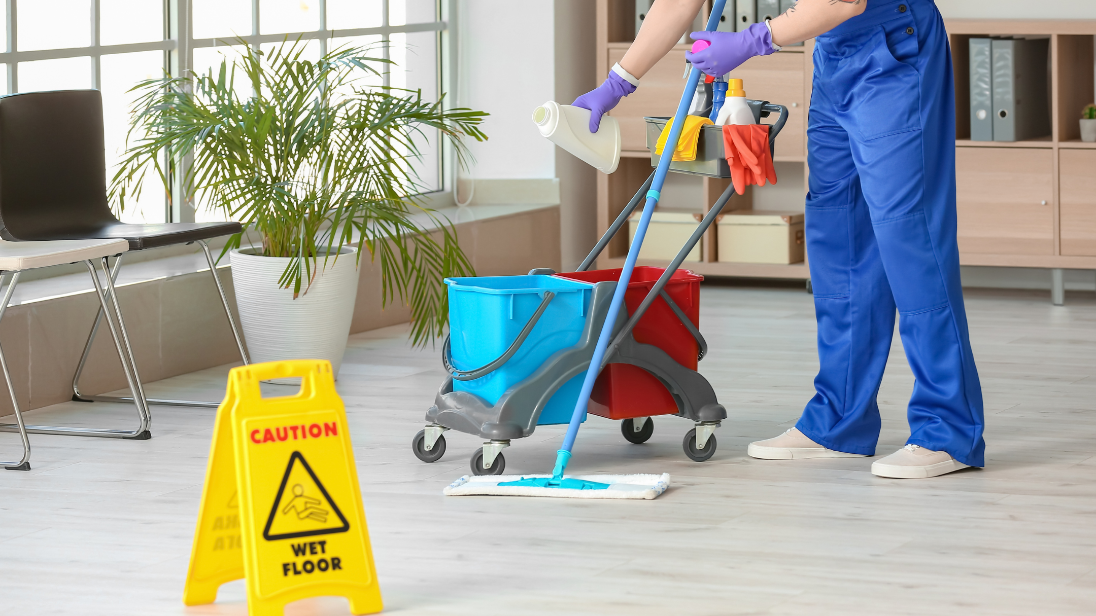 Maid mopping the office floor