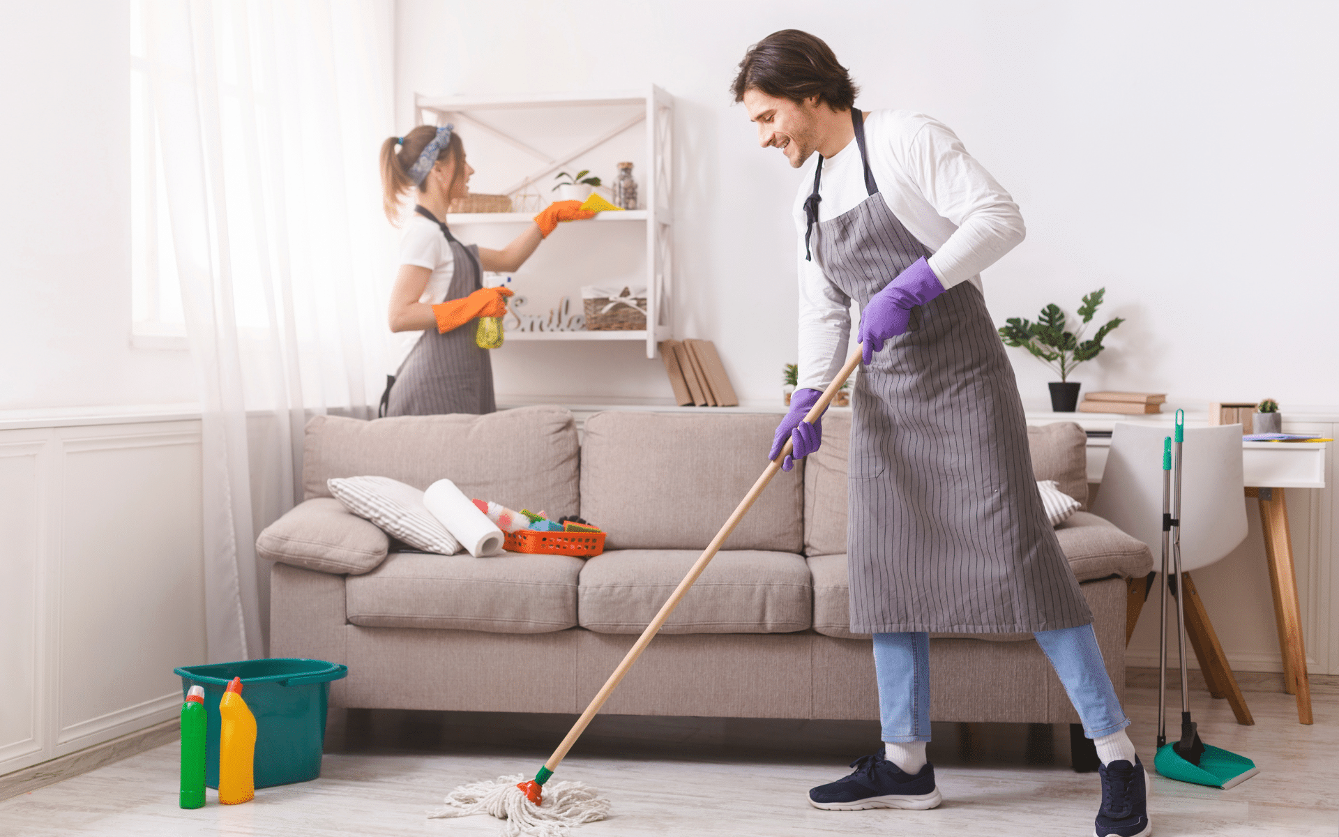 2 maids cleaning living room