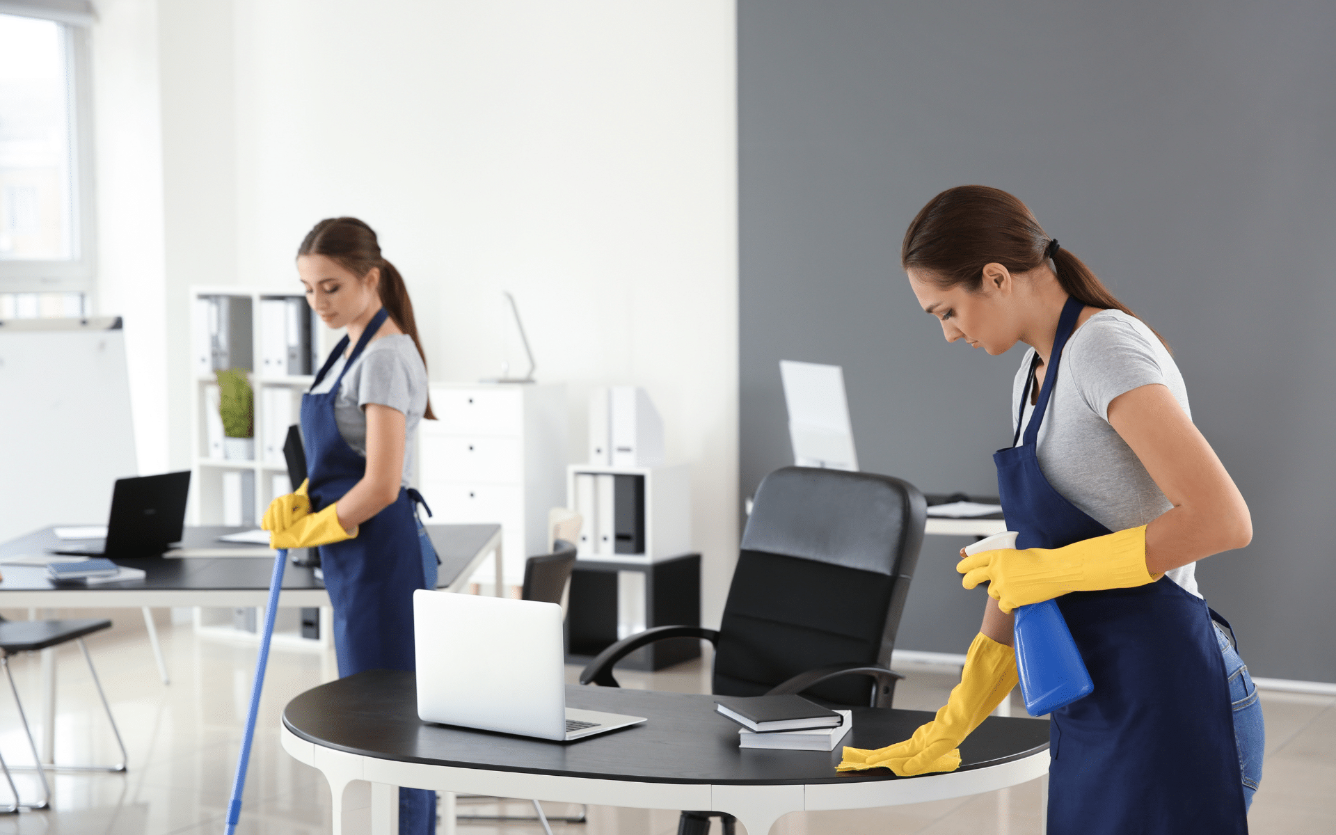 2 cleaners cleaning office